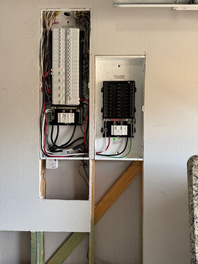 Electrical panel installation with circuit breakers and wiring in a residential setting.
